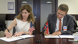 Karen Feldstein, NASA Deputy Associate Administrator for International and Interagency Relations and Per Erik Opseth, Director, Geodetic Institute of the Norwegian Mapping Authority.